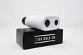 White golf rangefinder on a black TAG GOLF CO box against a white background
